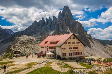 SESTO, ITALY - JULY 17, 2018: Rifugio Locatelli Drei Zinnen Natural park Italian Dolomites on a stunningly beautiful day in early summer clipart
