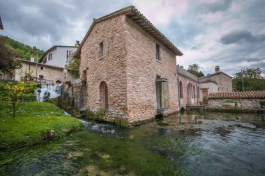 RASIGLIA, ITALY - OCTOBER 5, 2019: Old mill in the historic center of Rasiglia in Umbria clipart