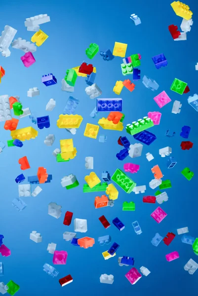 Pile Colored Toy Bricks Falling Dark Background — Stock Photo, Image