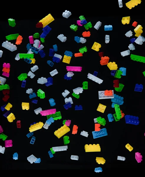 Pile Colored Toy Bricks Falling Dark Background — Stock Photo, Image