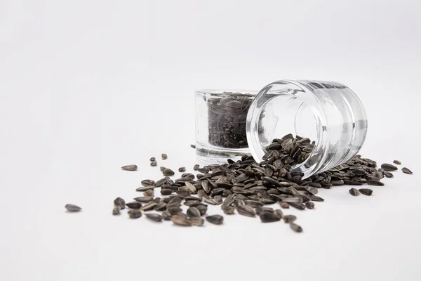 View Scattered Kidney Sunflower Seeds Glass Jar White Background — Stock Photo, Image