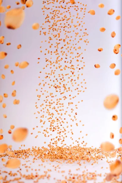 Stop motion soya beans splash or falling flying from the air on the surface on white background. Food object design concept.