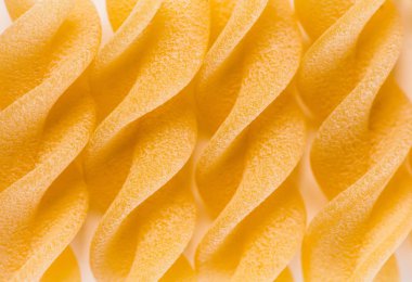 Makro yüzey closeup pişmemiş makarna arka plan. Stüdyo fotoğraf çekim.