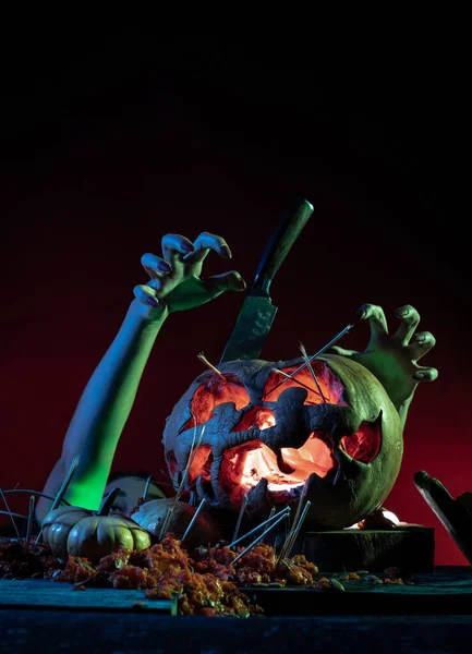 Scary Halloween pumpkins with kife in a spooky place at night. Poster concept — Stock Photo, Image