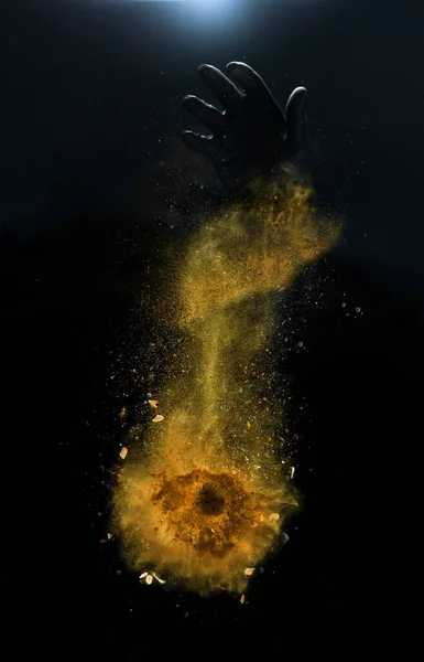 Orange spices powder explosion, flying pepper on black background. Freeze motion photo — Stock Photo, Image