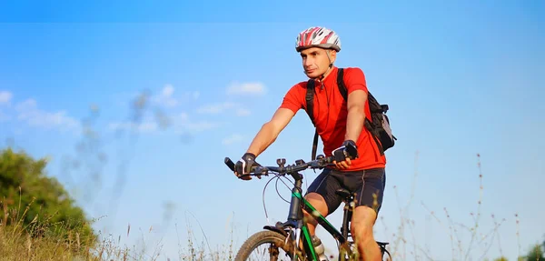 Wide picture of a cyclist at the wild nature