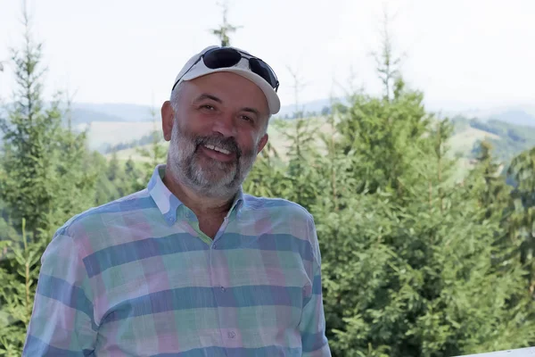 Man Mature Years Beard Smiling Background Green Trees — Stock Photo, Image