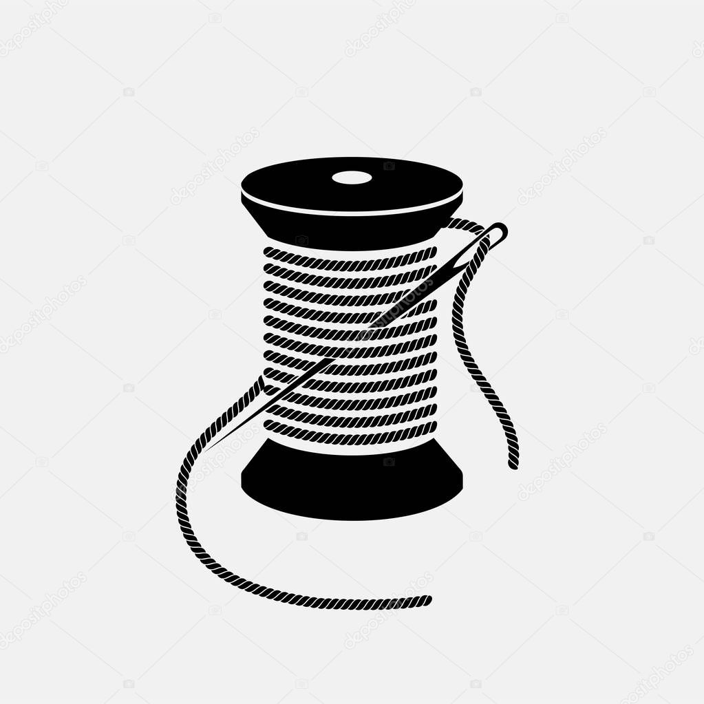 Spool of thread with needle vector icon