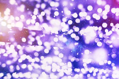 Bokeh soyut dokusu. Renkli. Odaklanmamış arka plan. Bulanık parlak ışık. Dairesel noktalar.