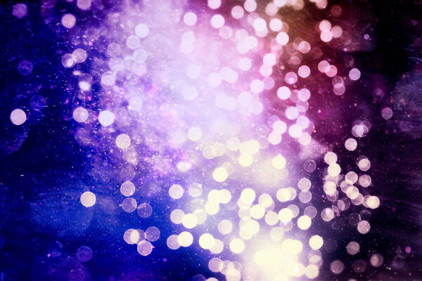 Abstract Festive background. Glitter vintage lights background with lights defocused. Christmas and New Year feast bokeh background with copyspace.