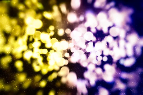 abstract blurred and silver glittering shine bulbs lights background:blur of Christmas wallpaper decorations concept.holiday festival backdrop:sparkle circle lit celebrations display.