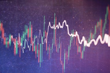 Borsa grafiği öndeki ekranda. Finans ve yatırım konsepti. Seçici odak.