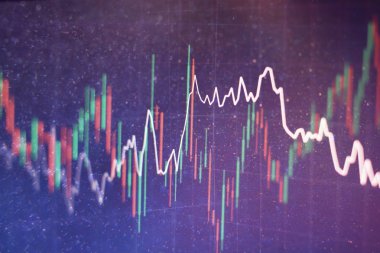 Borsa grafiği öndeki ekranda. Finans ve yatırım konsepti. Seçici odak.