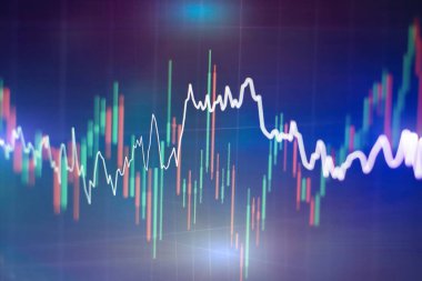 Borsa grafiği öndeki ekranda. Finans ve yatırım konsepti. Seçici odak.