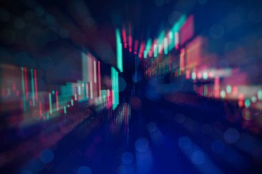 Borsa grafiği öndeki ekranda. Finans ve yatırım konsepti. Seçici odak.