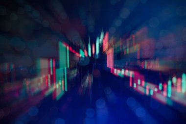 Borsa grafiği öndeki ekranda. Finans ve yatırım konsepti. Seçici odak.