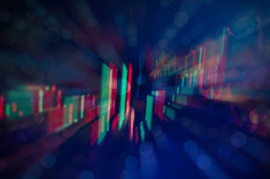 Borsa grafiği öndeki ekranda. Finans ve yatırım konsepti. Seçici odak.