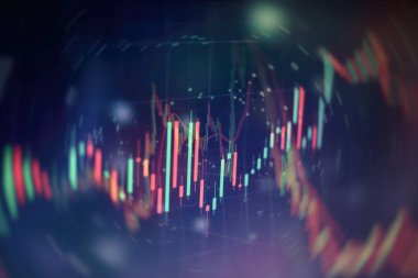 Borsa grafiği öndeki ekranda. Finans ve yatırım konsepti. Seçici odak.