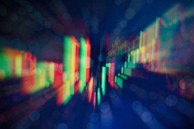 Borsa grafiği öndeki ekranda. Finans ve yatırım konsepti. Seçici odak.