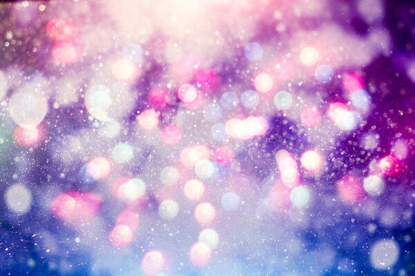 Abstract background of blurred yellow lights with bokeh effect