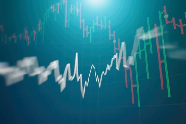 Borsa grafiği öndeki ekranda. Finans ve yatırım konsepti. Seçici odak