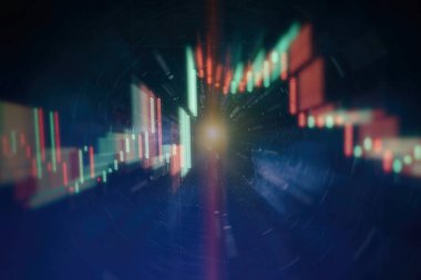 Borsa grafiği öndeki ekranda. Finans ve yatırım konsepti. Seçici odak.