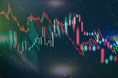 Borsa grafiği öndeki ekranda. Finans ve yatırım konsepti. Seçici odak.