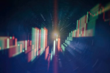 Borsa grafiği öndeki ekranda. Finans ve yatırım konsepti. Seçici odak.