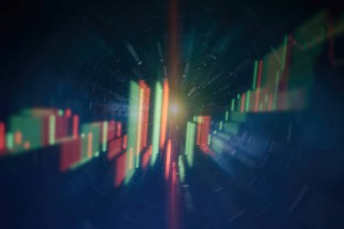 Borsa grafiği öndeki ekranda. Finans ve yatırım konsepti. Seçici odak.