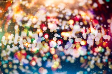 Noel ışığı arka planı. Parlak tatil arkaplanı. Yanıp sönen Yıldızlarla Odaklanmış Arkaplan. Bulanık Bokeh.