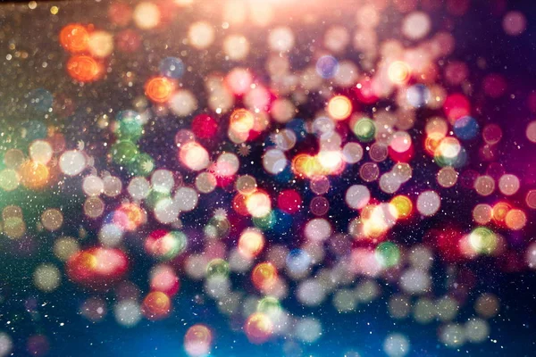 Sfondo luce di Natale. Vacanza sfondo incandescente. Sfondo sfocato con stelle lampeggianti. Bokeh offuscata. — Foto Stock