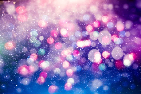 Fondo de luz de Navidad. Fondo brillante de vacaciones. Fondo desenfocado con estrellas parpadeantes. Bokeh borrosa. —  Fotos de Stock