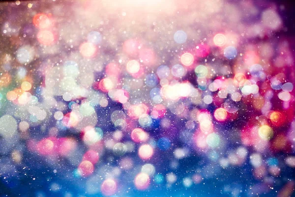 Julbelysning bakgrund. Semester glödande bakgrund. Oskärpa bakgrund med Blinka stjärnor. Suddig Bokeh. — Stockfoto