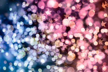 Noel ışığı arka planı. Parlak tatil arkaplanı. Yanıp sönen Yıldızlarla Odaklanmış Arkaplan. Bulanık Bokeh.