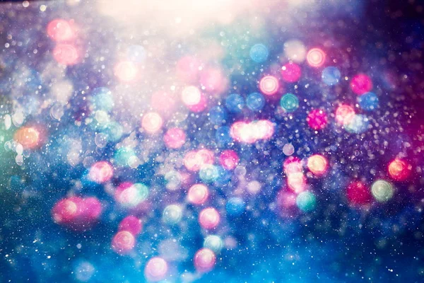 Fondo de luz de Navidad. Fondo brillante de vacaciones. Fondo desenfocado con estrellas parpadeantes. Bokeh borrosa. —  Fotos de Stock