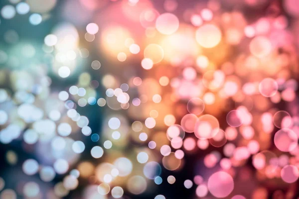 Fundo de luz de Natal. Fundo brilhante de férias. Contexto desfocado com estrelas cintilantes. Bokeh desfocado. — Fotografia de Stock