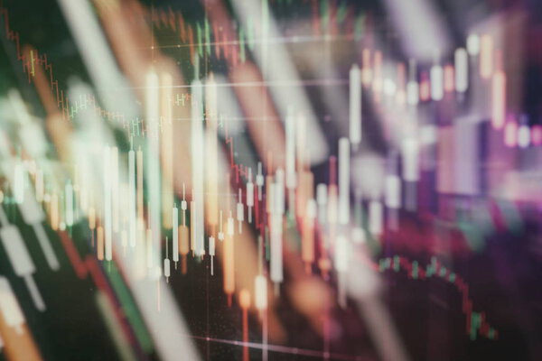 Analysis business accounting on info sheets. Businessman hand working on analyzing investment charts for Gold market, Forex market and Trading market.