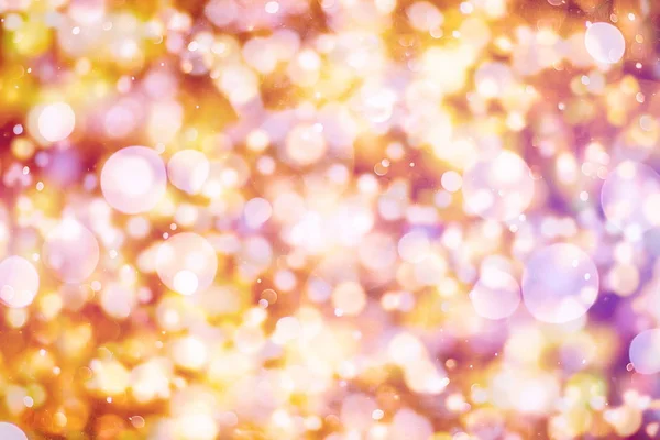 Fialové a žluté abstraktní pozadí. bokeh rozmazaná nádherná lesklá světla vánoční — Stock fotografie