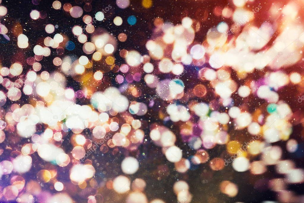 Festive background with natural bokeh and bright golden lights. Vintage Magic background with colorful bokeh.