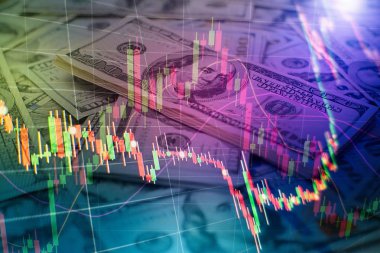 Borsa grafiği öndeki ekranda. Finans ve yatırım konsepti. Seçici odak.