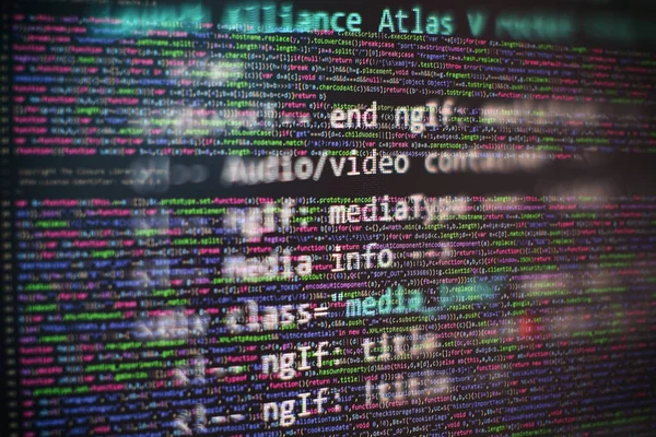CSS, JavaScript and HTML usage. Monitor closeup of function source code. Abstract IT technology background. Software source code.
