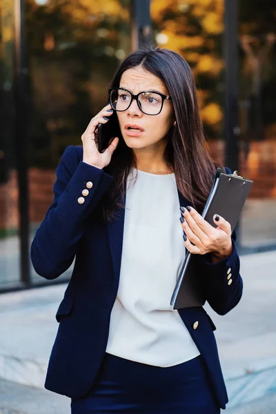 Businesswoman screaming on mobile phone. Having nervous breakdown at work, screaming in anger, stress management, mental distress problems, losing temper, reaction on failure.