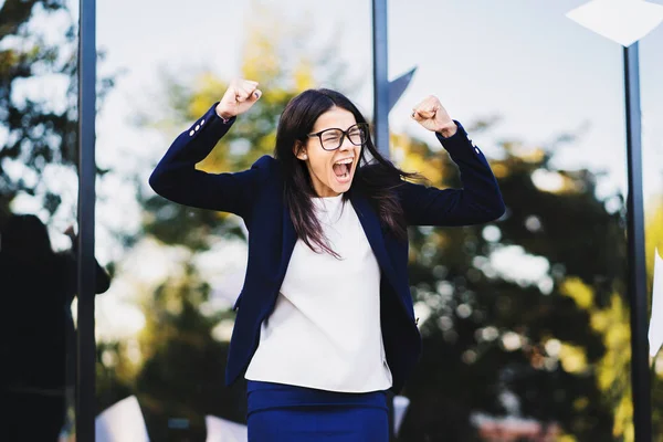 Angry furious female businesswoman screaming in anger. Stress management, mental distress problems, losing temper, reaction on failure. throwing crumpled paper, having nervous breakdown at work.