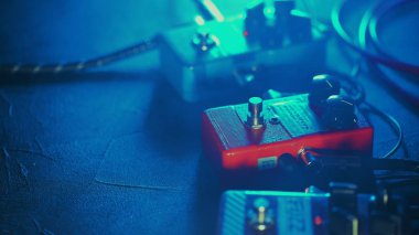 Close up of guitar pedals. music effect loop machine. Macro view clipart