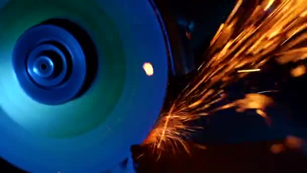 Close-up of worker at construction plant saws metal using circular saw. Industrial production, locksmith industry concept . Sparks from grinding wheel. — Stock Video