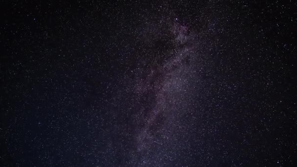 Night sky with stars, Milky Way passing in long exposure timelapse. Beautiful panorama view. Nature, universe, galaxy, astronomy concept. — Stock Video