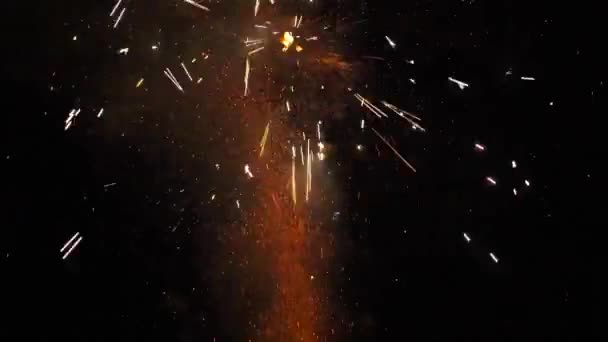 Sparkling fireworks on black background during celebrating holiday. Perfect for creating video effects, digital compositing. — Stock Video
