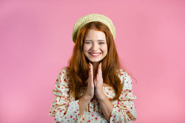 Excited gorgeous woman cant believe, clapping hands - she won lottery prize. Surprised, satisfied with great news, looking at camera with amusement. Pink studio background.