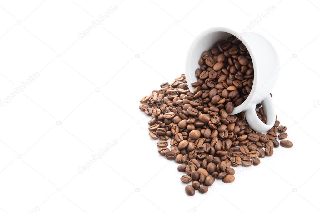 ceramic cup filled with roasted coffee beans isolated on a white background