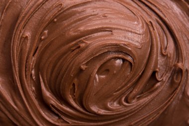 Çikolatalı kremanın makro fotoğrafı ya da tam arka plana yayılmış hali. Yakın dokusu.